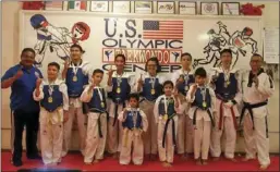  ?? COURTESY OF JORGE ENRIQUEZ ?? Members of the U.S. Olympic Taekwondo Center in El Centro smile for a photo after faring well in the 2018 Amateur Athletic Union Regional Qualifier held at the Arizona State University campus in Tempe on Feb. 24. PHOTO