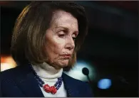  ?? AP/CAROLYN KASTER ?? House Speaker Nancy Pelosi pauses Thursday during a news conference on Capitol Hill before her overseas trip was canceled. She was calling for an end to the shutdown so federal workers could be paid.