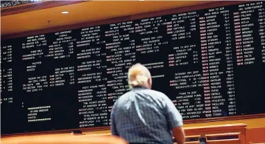  ?? AP ?? In this Monday, May 14, 2018 photo, betting odds are displayed on a board in the sports book at the South Point hotel and casino in Las Vegas.