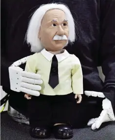  ??  ?? The soon to be released Albert Einstein Robot from Hanson Robotics is displayed at their booth on the showroom floor during the 2017 Consumer Electronic Show (CES) at the Las Vegas Convention Center in Las Vegas, Nevada, on January 5, 2017.