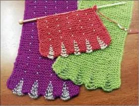  ?? PHOTO BY GINGER BALCH ?? Learn to knit this pretty beaded, scalloped scarf during a free class at In Sheep’s Clothing on Water Street, Torrington.