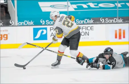  ?? Josie Lepe The Associated Press ?? Knights defenseman Shea Theodore motors away from a diving stick check by Sharks defenseman Nikolai Knyzhov in the first period.