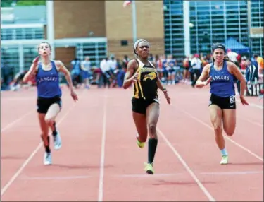  ?? COLEEN MOSKOWITZ — THE NEWS‑HERALD ?? Beachwood’s Mia Knight wins the 100 meters during the Division II Perry District meet.
