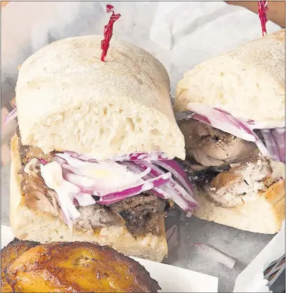  ?? [ROB HARDIN/ALIVE] ?? The chicharron Peruano sandwich with a side of plantains at Si Senor! near Grandview Heights