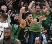  ?? STEVEN SENNE — THE ASSOCIATED PRESS ?? Boston Celtics forward Jayson Tatum (0) celebrates after making a layup at the buzzer to score and end Game 1 of an NBA basketball first-round Eastern Conference playoff series against the Brooklyn Nets, Sunday in Boston. The Celtics won 115-114.