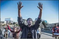  ?? HECTOR AMEZCUA/SACRAMENTO BEE ?? Black Lives Matter supporters walk on to the northbound Interstate 5 on-ramp from I street near Old Sacramento on Thursday during a rally for Stephon Clark, an unarmed black man who was shot by Sacramento Police on Sunday night in his backyard.