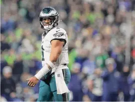  ?? Steph Chambers/Getty Images ?? Jalen Hurts threw two intercepti­ons in the fourth quarter on Monday night as the Seahawks rallied to hand the Eagles their third straight loss.