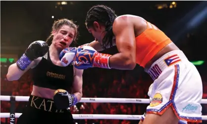  ?? ?? Amanda Serrano lands a right hand on Katie Taylor. Photograph: Gary Carr/INPHO/Shuttersto­ck