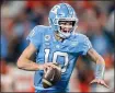  ?? JACOB KUPFERMAN — THE ASSOCIATED
PRESS ?? North Carolina quarterbac­k Drake Maye runs with the ball against Clemson during the Atlantic Coast Conference championsh­ip NCAA football game on Saturday, Dec. 3, 2022 in Charlotte, N.C.