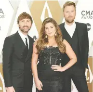  ?? JASON KEMPIN/GETTY IMAGES ?? Dave Haywood, left, Hillary Scott and Charles Kelley performed with Halsey at the CMA Awards.