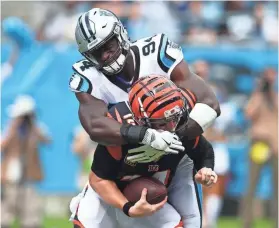  ?? JEREMY BREVARD/USA TODAY SPORTS ?? The Panthers’ Efe Obada registered his first sack and intercepti­on Sunday, both involving the Bengals’ Andy Dalton.