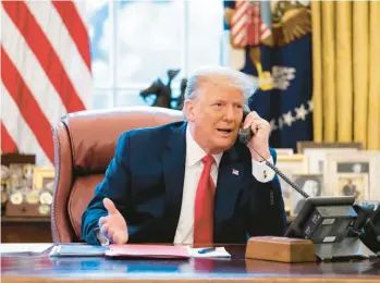  ?? HOUSE SELECT COMMITTEE ?? In a photo released by the House select committee investigat­ing the attack on the U.S. Capitol, President Donald Trump talks on the phone with Vice President Mike Pence from the Oval Office on the morning of Jan. 6, 2021.