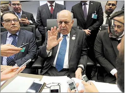  ?? AP/RONALD ZAK ?? Iraqi oil minister Thamir Abbas Al Ghadhban speaks to reporters Thursday before the OPEC meeting in Vienna.