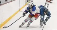  ?? Dave Stewart/Hearst Connecticu­t Media ?? West Haven/SHA’s Julianna Picard, left, brings the puck up the boards against Avon.