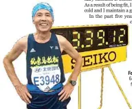  ??  ?? Feng Kaichen, 64, with his finishing time after a marathon in Beijing.