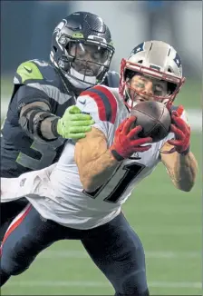  ?? AP FILE ?? New England Patriots wide receiver Julian Edelman makes a reception during last week’s game against the Seattle Seahawks.