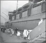  ?? (File Photo/AP) ?? Some of the 991 Japanese repatriate­s, who boarded the steamship Matsonian in Seattle the final lap of their trip home to Japan in December 1945. Most came from Texas, where they had been held in an internment camp.