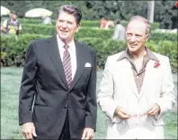  ?? CP FILE PHOTO ?? Former U.S. president Ronald Reagan and former Canadian prime minister Pierre Elliott Trudeau walk together in July 1981 during the summit of the world’s leading industrial countries.