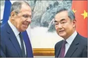  ?? AP ?? Sergey Lavrov (left) and Chinese foreign minister Wang Yi pose for a photo prior to their talks in Beijing, China, on Tuesday.