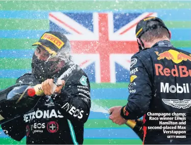  ?? GETTY IMAGES ?? Champagne champ: Race winner Lewis
Hamilton and second-placed Max
Verstappen