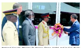  ?? PHOTO BY ALBERT FERGUSON ?? National Security Minister Dr Horace Chang (right) and Lt Gen Rocky Meade (second right) cut the ribbon to officially open the Jamaica Defence Force’s Burke Barracks in Flankers, Montego Bay, St James, yesterday. Also sharing in the occasion are (from left) Lt Col Godphey Sterling, commanding officer for the Second Battalion, The Jamaica Regiment; Peter Melhado, chairman of WIHCON; Dr David Stair, custos of Hanover.