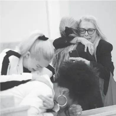  ?? MARK MAKELA / POOL PHOTO VIA THE ASSOCIATED PRESS ?? Accuser Lili Bernard, foreground, is consoled by grief counsellor Caroline Heldman, left, as accuser Victoria Valentino, right, is comforted outside the courtroom after Bill Cosby was found guilty in his sexual assault retrial.