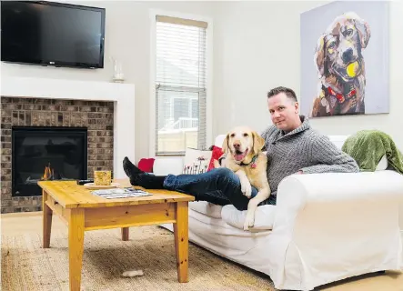  ?? DON MOLYNEAUX ?? Jeff Langdon with his dog Cheyenne in his new Homes by Dream home in EvansRidge.