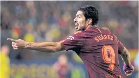  ??  ?? Barcelona’s Luis Suarez wheels away after scoring against Villarreal.