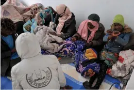  ?? ?? Detained migrants in Tunis. People from sub-Saharan Africa have been living in fear of arrest by Tunisian authoritie­s. Photograph: Yassine Mahjoub/Rex