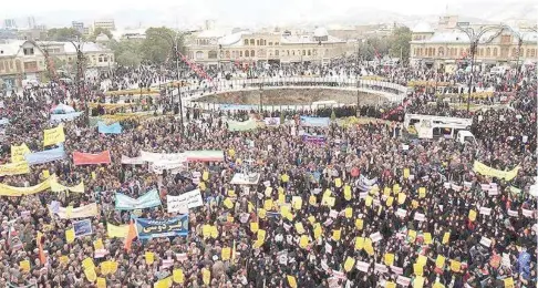  ??  ?? Iranian people gather to mark the anniversar­y of the seizure of the US Embassy, in Tehran, on Sunday. — Reuters