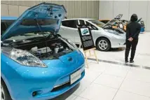 ?? YURI KAGEYAMA/AP ?? Nissan displays its ecological models March 7 at its Yokohama headquarte­rs in Japan.