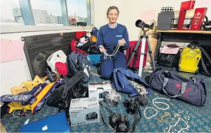  ?? PHOTO: SUPPLIED ?? Not a bad haul . . . Constable Kylie Batten, of Dunedin, with stolen items recovered after police searched a Brockville property.