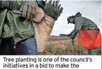  ?? (Image: PA) ?? Tree planting is one of the council’s initiative­s in a bid to make the borough greener