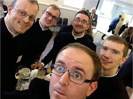  ??  ?? Holy orders: The priests at an ordination before going to the pub. Right: The Rev Robert James enjoys a pint of his namesake’s beer