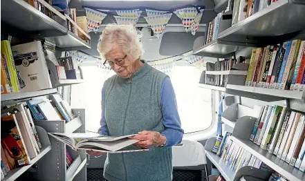  ?? ALDEN WILLIAMS/STUFF ?? Russley Village resident and keen reader Anne Brown relies on the Christchur­ch City Council mobile bus to borrow books for herself and her husband.