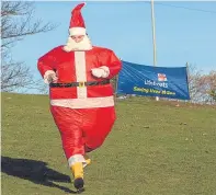  ?? Picture: Steven Brown. ?? Runners in last year’s Santa run for Kinghorn RNLI, which will be repeated this year.