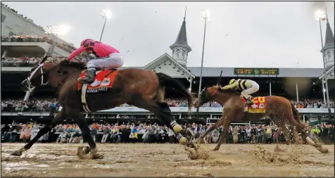  ?? — THE ASSOCIATED PRESS ?? Luis Saez rides Maximum Security, left, across the finish line first followed by Flavien Prat on Country House during the 145th running of the Kentucky Derby yesterday at Churchill Downs. Top left, Prat, however, was the one smiling at the end after Maximum Security was disqualifi­ed and Country House declared the winner.