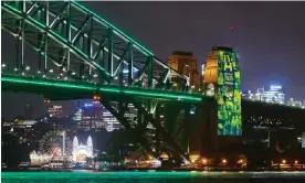  ?? ?? The Sydney Harbour Bridge is lit in support of Australia's 2027 and 2029 Rugby World Cup bids. Photograph: Brett Hemmings/Getty Images for Rugby Australia