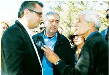  ??  ?? President Mustafa Akıncı (centre) and Prime Minister Tufan Erhürman talking to a villager (right) at the Geçitkale gathering