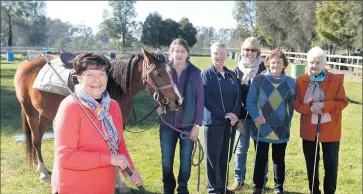  ??  ?? In the paddock: Mooroopna Ladies Golf Club president Mary Williams with Nikita the horse, RDA secretary Cathy Hamilton, Penny Johnson, Helen Kiss, Sandy O’Connor and Lorna Grant ahead of a recent fundraiser day.