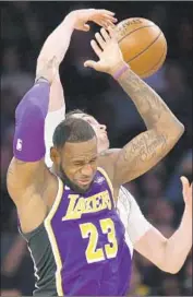  ?? Seth Wenig ?? LeBRON JAMES and the Lakers have little to gain by subjecting him to more wear and tear this season.