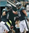  ?? MICHAEL PEREZ — THE ASSOCIATED PRESS ?? Philadelph­ia Eagles’ Zach Ertz, left, and Trey Burton celebrate after Ertz’s touchdown during the first half of an NFL football game against the Arizona Cardinals, Sunday.