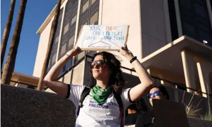  ?? Photograph: Rebecca Noble/Reuters ?? Protesters rally after the state’s supreme court revived an 1864 law that bans abortion in virtually all instances, in Tucson, Arizona, on 9 April 2024.