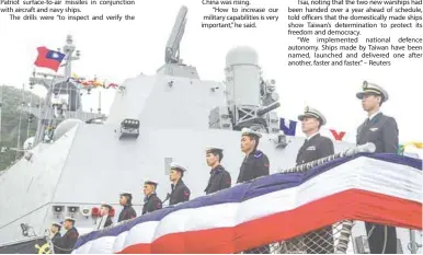  ?? AFPPIC ?? Naval officers and crew stand to attention on a Taiwan-made warship during an inaugurati­on ceremony in Yilan yesterday. –