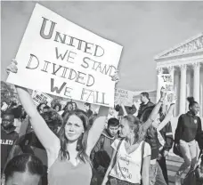  ?? SHAWN THEW, EUROPEAN PRESSPHOTO AGENCY ?? People protest against President-elect Donald Trump in front of the Supreme Court in Washington on Nov. 15.