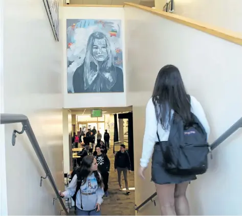  ?? SOPHIA MUYS/ PALY VOICE VIA THE ASSOCIATED PRESS ?? Students pass under one of James Franco’s paintings displayed above a stairwell in the Media Arts Center at Palo Alto High School in Palo Alto, Calif. Actor and director Franco is a 1996 graduate of the school. Franco’s former high school has taken...