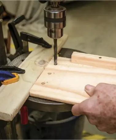  ??  ?? Right: Drilling the holes for the coach bolts that will fasten the rails to the ends of the bed