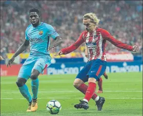  ??  ?? Griezmann, en octubre ante el Barça En la imagen, con su compatriot­a Umtiti