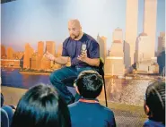  ?? HBO VIA AP ?? A New York City fireman speaks to children in a scene from the documentar­y What Happened on September 11, a short film aimed at people too young to remember the attacks that attempts to explain them.