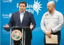  ?? CHRIS O’MEARA/AP ?? Gov. Ron DeSantis, left, speaks as he stands with Kevin Guthrie, director of the Florida Division of Emergency Management, during a news conference Sept. 26, 2022, in Largo. DeSantis was keeping residents updated on the track of Hurricane Ian.